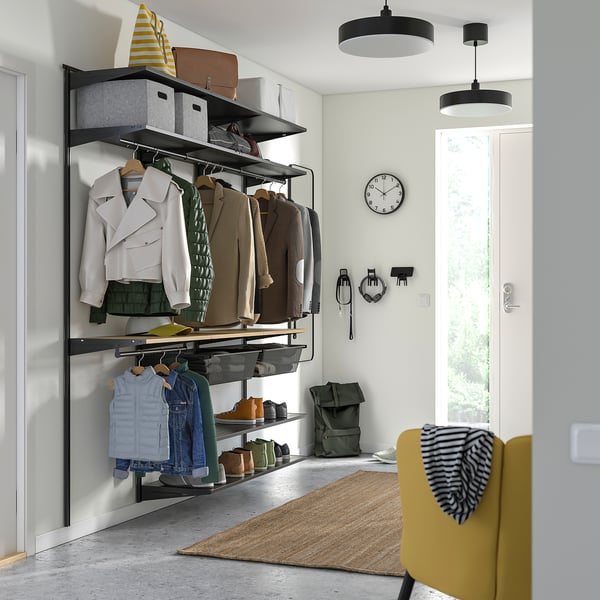 BOAXEL closet with clothes and accessories. Jackets, jeans, hat, bag, clock, chair, backpack.