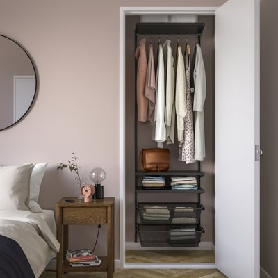 Organised closet with BOAXEL system; dark grey; metal & particleboard; hangers, shelves, & mesh baskets; fits neatly beside bed.