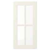 Off-white BODBYN door with bevelled panels, smooth lacquered surface, and tempered glass – ideal for traditional kitchens.