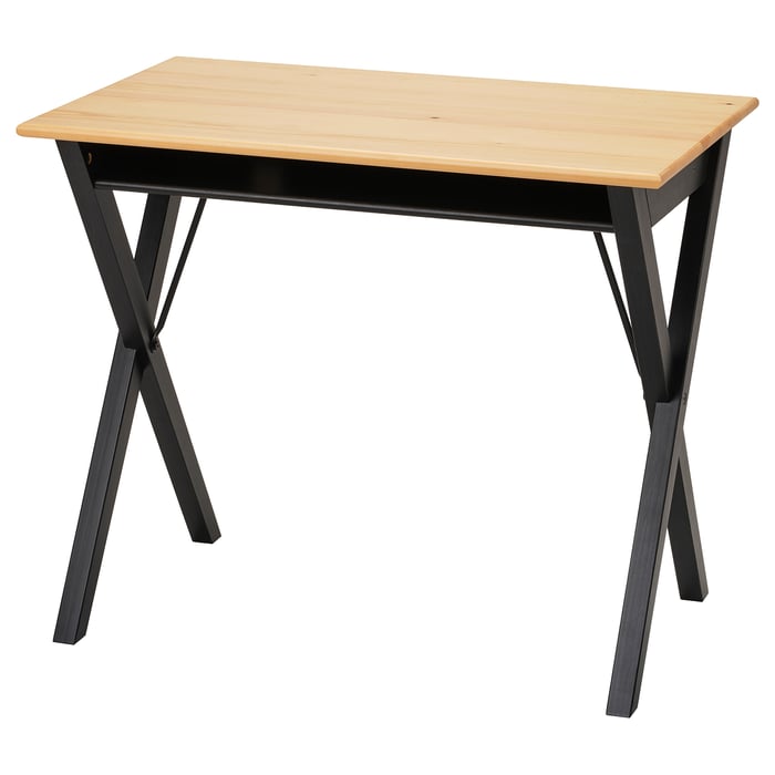The BOLLPOJKE desk with a light wooden top, black metal legs, and a simple, functional design.