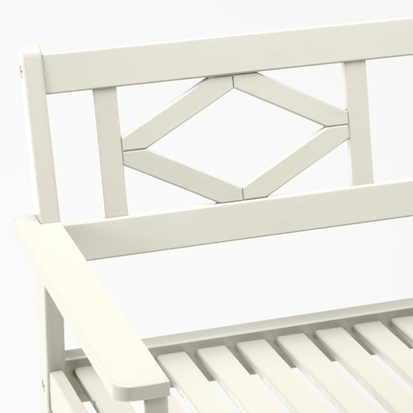 White outdoor bench with geometric backrest detail, sturdy acacia wood construction.
