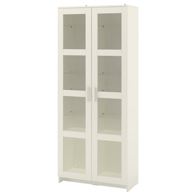 A white BRIMNES glass-door cabinet. Its rectangular with a minimalist design, showcasing tempered glass doors and shelves.