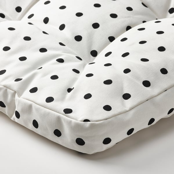 Protective black-dot chair cushion, designed for childrens comfort, showcasing quality stitching and even wear design.