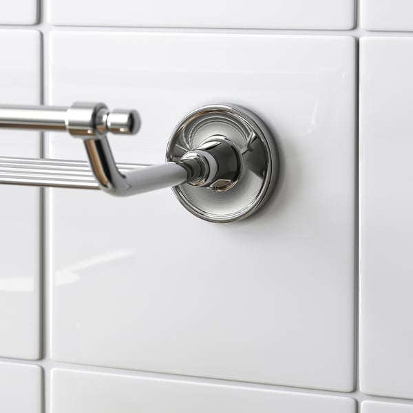 Elegant chrome-finished wall shelf with hidden screws, stainless steel construction ensures durability.