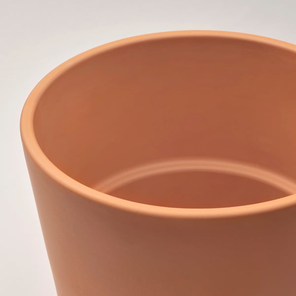 Terracotta planter close-up, smooth surface, no plants.