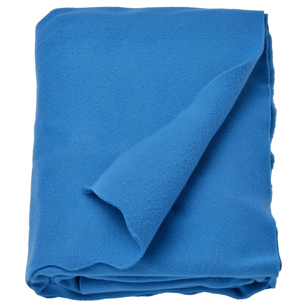 Bright blue rectangular fleece throw, neatly folded, soft and inviting.