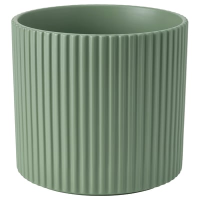 Modern green pottery with vertical grooves.