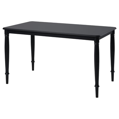 Black rectangular dining table. Four straight legs, sleek design. Durable lacquered mdf top, sturdy steel legs.