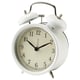 White alarm clock, classic design, round shape, silent quartz movement.