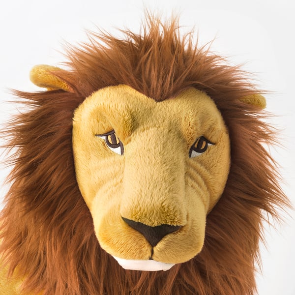 Plush lion toy with lifelike mane, expressive eyes, and soft fabric; perfect for cuddling.
