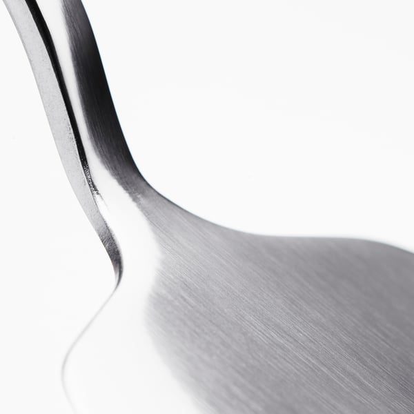 Stainless steel cake slicer, sleek and sturdy, reflects light on its smooth surface.