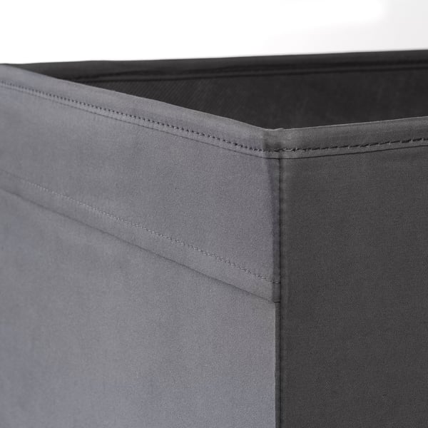 Close-up of grey fabric storage box with neat stitching, showing quality material and craftsmanship.