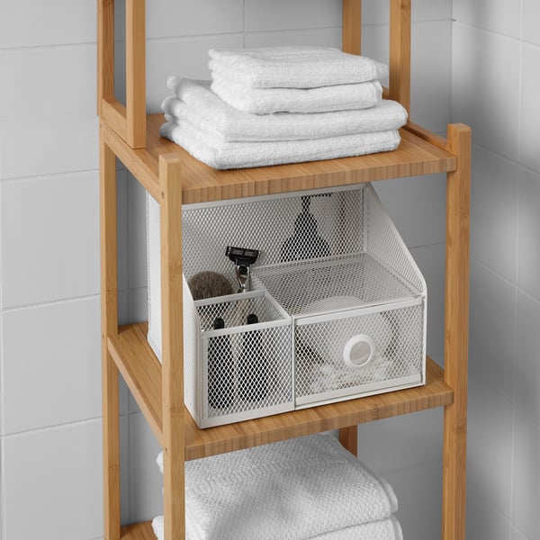 Bamboo shelf with wire basket and towels, used for bathroom storage.