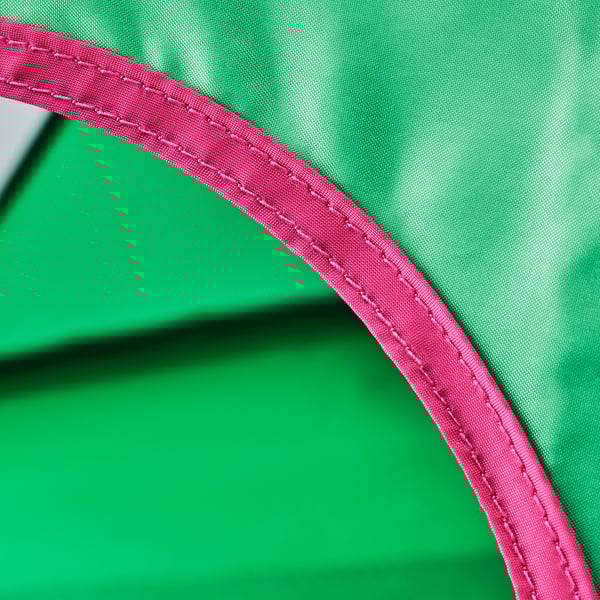Close-up of a sturdy, vibrant pink-edged tent fabric, showcasing quality stitching and durable material.