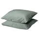 Two square-shaped DVALA pillows in grey-green, made of 100% cotton, stacked neatly.