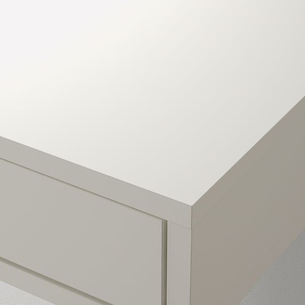 Precision-cut white particleboard with smooth edges, part of a modern wall-mounted shelf and drawer unit.