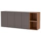 An EKET wall-mounted cabinet set in dark grey with light wood accents. It closed storage, open shelves, and sleek design.