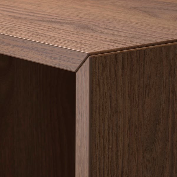 Dark wood grain cabinet corner, clean finish.