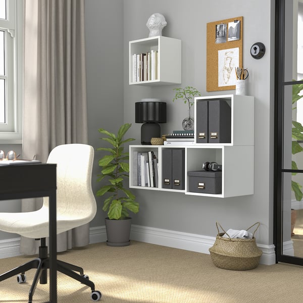 Home office with EKET storage, desk, chair, and decor.