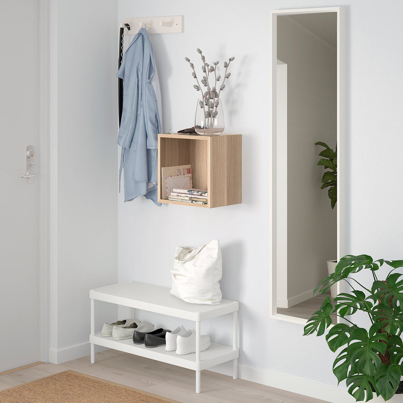 EKET cube storage with jacket & decor; bench below, mirror & plant.