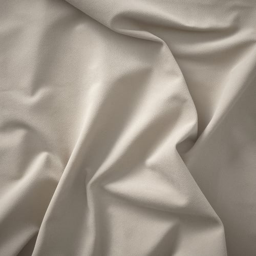 Smooth, light-colored fabric; soft texture, likely upholstery or bedding.