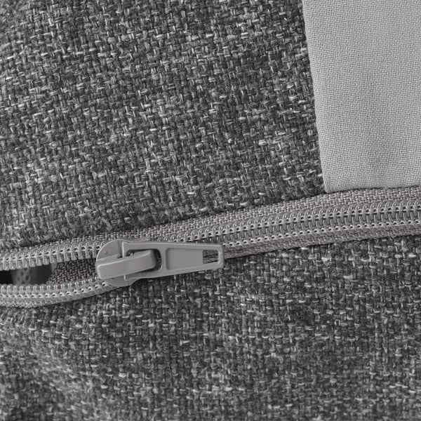 Close-up of high-quality zip on textured fabric, showcasing durability and craftsmanship.