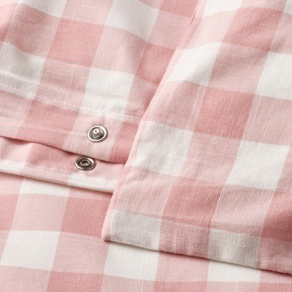Light pink and white gingham duvet cover with metal snap closure.
