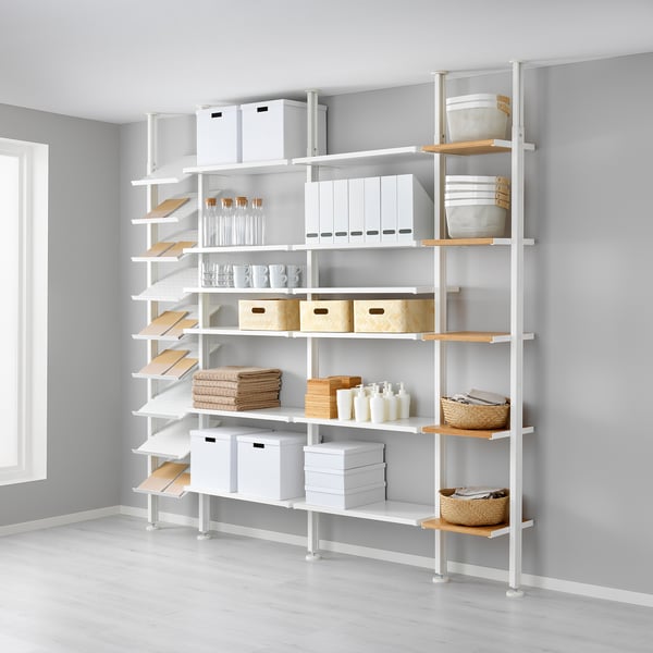 A white ELVARLI storage system with adjustable shelves and bamboo accents, organised with various items.