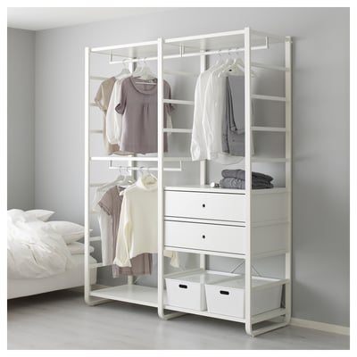 ELVARLI white storage, shelves, hanging rods, clothes, drawers, baskets. Tall next to bed.