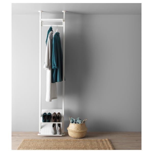Modern, white ELVARLI storage unit with clothes and shoes. Teal and white items shown.