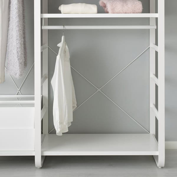 White ELVARLI storage unit with shelf and hanging garment, perfect for organising clothes and towels. Simple, adaptable design.