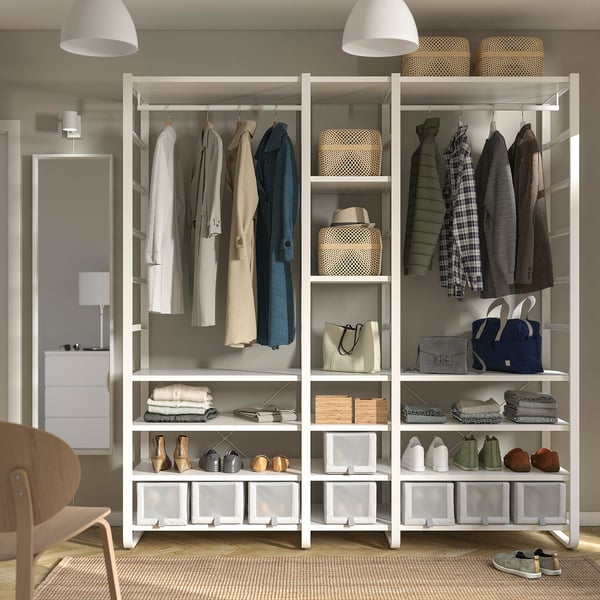 Modern closet with open shelves and hanging space, neatly organising clothes and accessories.