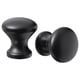 Two black cabinet knobs; one rounded, one cylindrical, both stylish and modern.