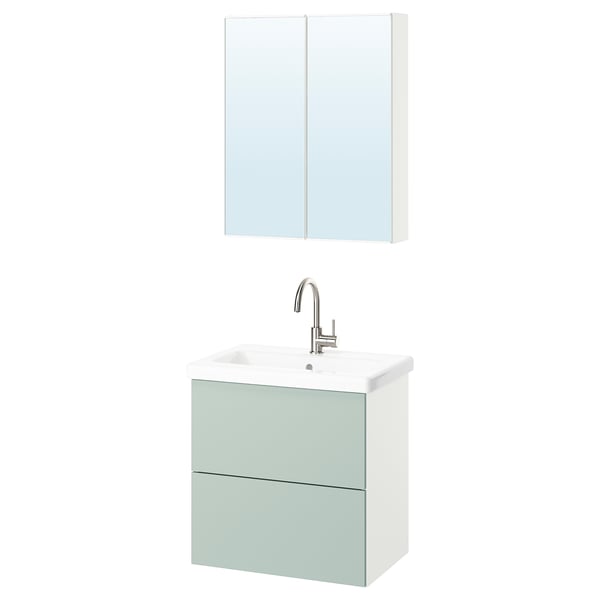 Green cabinet, white sink, mirror above.