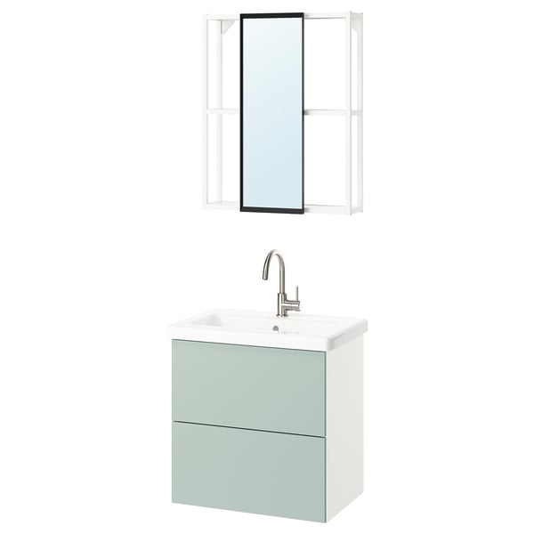 Modern bathroom with light green vanity, wall-mounted mirror, and white sink with chrome tap.