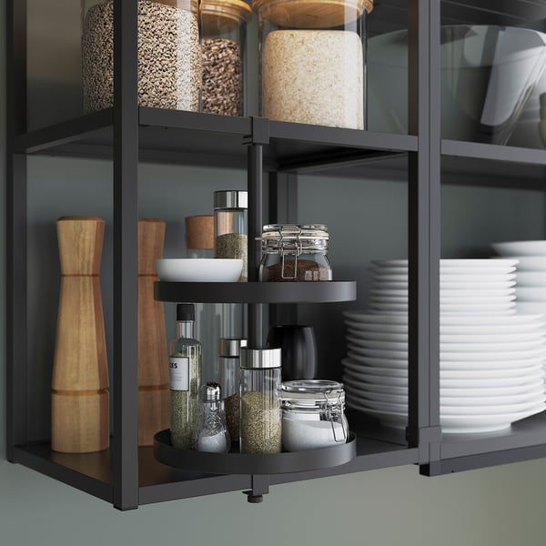 Modern kitchen storage: spice jars on rotating shelves, accessible spice organiser.