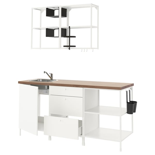 Modern white kitchen setup: ENHET. Includes sink, shelves, drawers, and hooks. Mainly white with wood counter.