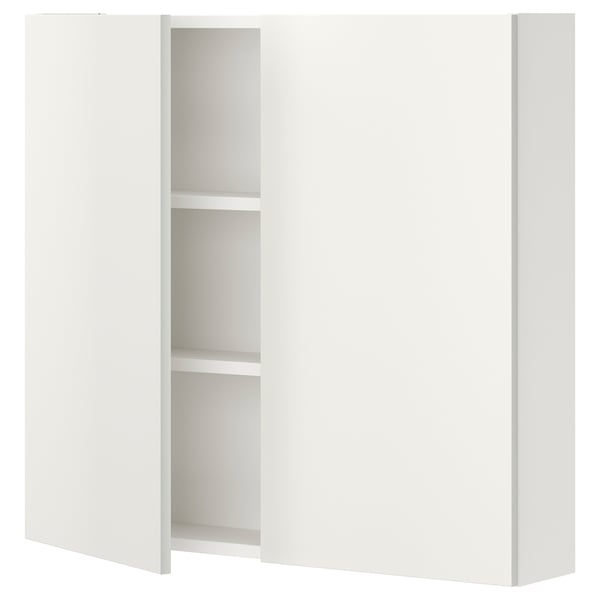 White ENHET wall cabinet with two shelves for bathroom storage.