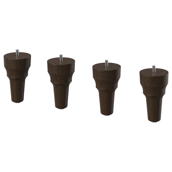 Four dark brown wooden furniture legs with screws, neatly arranged in a row.