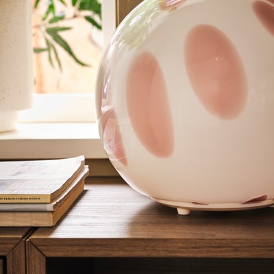 FADO lamp: grey-tinted glass globe on white base. Round shape, decorative. Soft, cosy light.