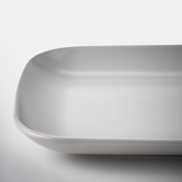 Smooth, light grey rectangular dish with rounded edges, clean and simple design, resting on a plain surface.