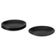 This image shows black round plates. Four stacked together with one separate. Elegant, modern design, made of stoneware.