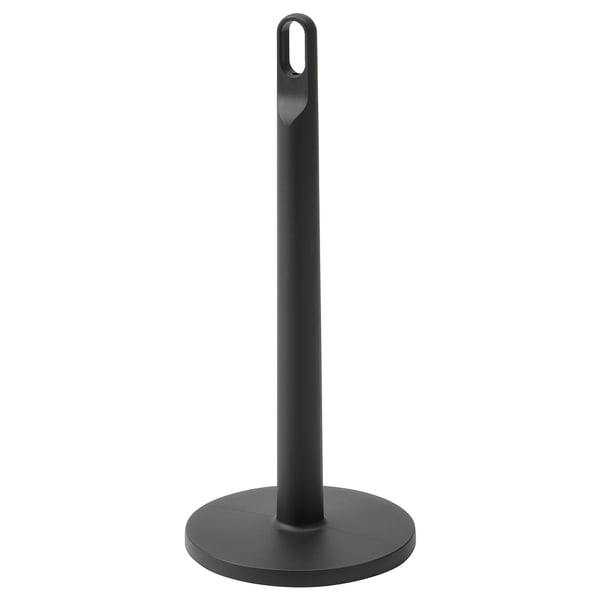 A black FAMILJ paper towel holder. It is tall with a circular base, made of polypropylene plastic, and has a loop at the top for carrying.