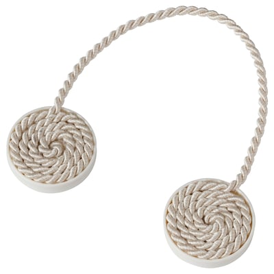 A beige rope-like curtain tie-back with magnetic ends. It’s circular at both ends and flexible, designed to hold curtains open without drilling.