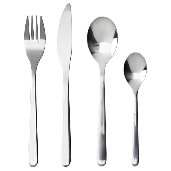 A set of four polished silver cutlery pieces: a fork, a knife, a spoon, and a teaspoon, neatly arranged in a row.
