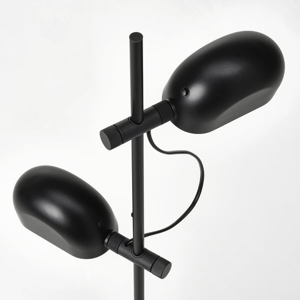 Modern black floor lamp with two adjustable, independently controlled lamps.