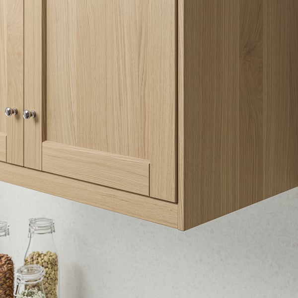 Wooden cabinet with sleek handles and lighting.