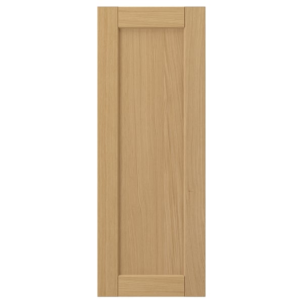 Forsbäcka light oak wooden door, rectangular with bevelled edges.