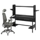 Black gaming desk and chair set. Desk has metal frame, shelves, and black top. Chair has mesh back, adjustable armrests, and black base.