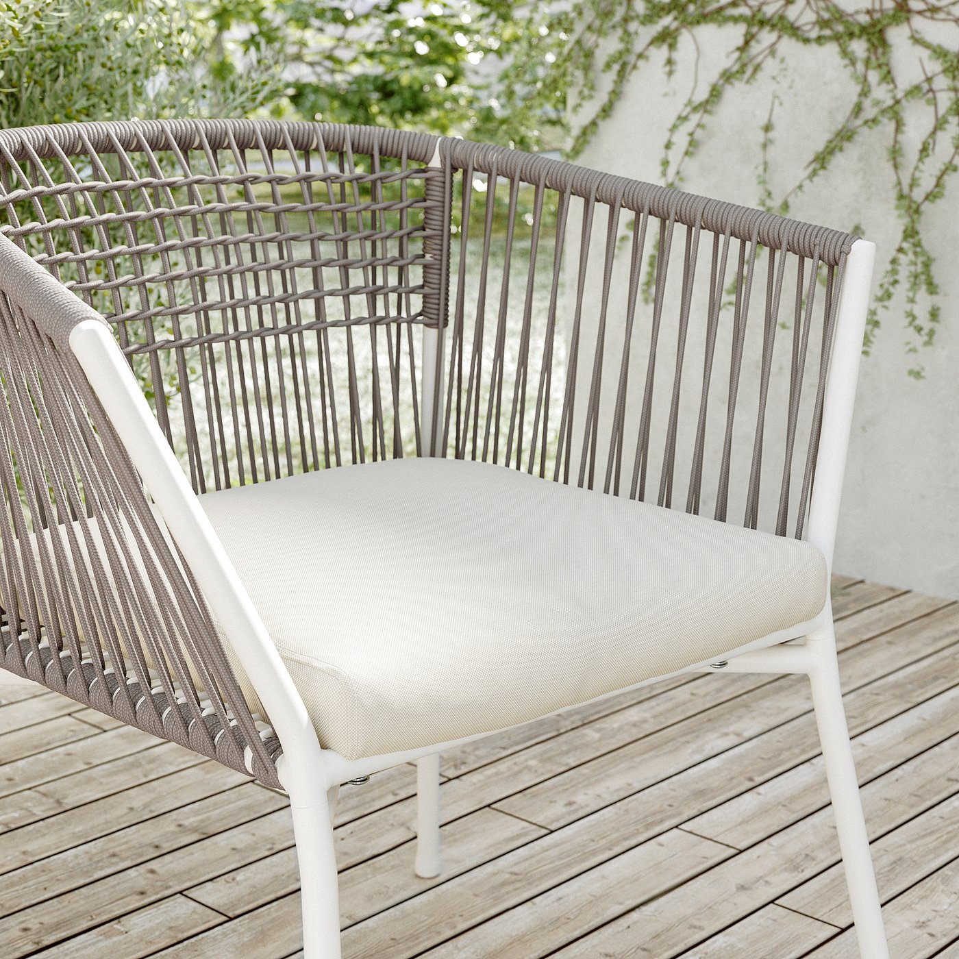Modern white patio chair with woven back, beige cushion.